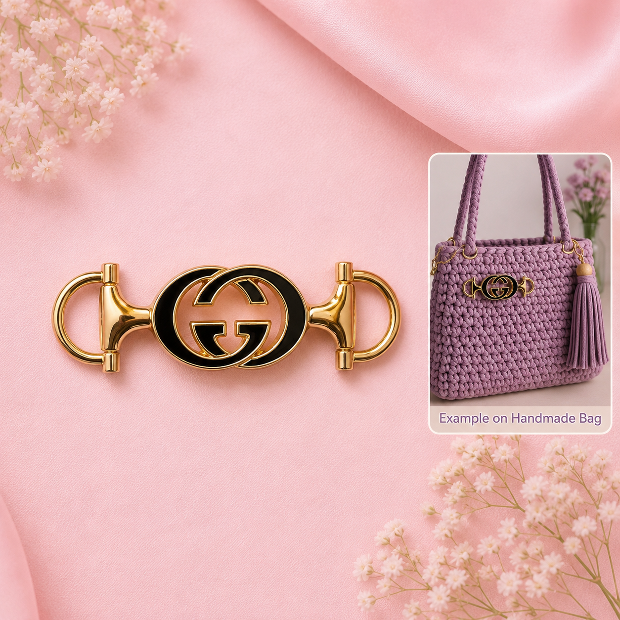 A gold-tone horsebit-style Gucci keychain with a black interlocking GG logo, displayed on a pink satin background with baby's breath flowers. An inset image in the top-right shows a lavender crocheted handbag with a matching gold-tone GG medallion and tassel, captioned 'Example on Handmade Bag'.